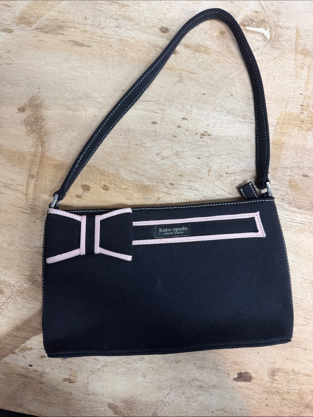 kate spade Black Clutch with Pale Pink Trim and Decorative Bow